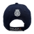 Vista trasera de gorra Policía Nacional azul marino con emblema bordado y cierre ajustable