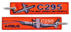 Llavero de tela avion Airbus C295 Naranja Fosforito bordado de alta calidad por delante y por detras the most capable and versatile