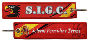 Llavero de tela SIGC Rojo con aguila en una cara bandera española en las dos caras escudo español solvent formidine terras buena calidad